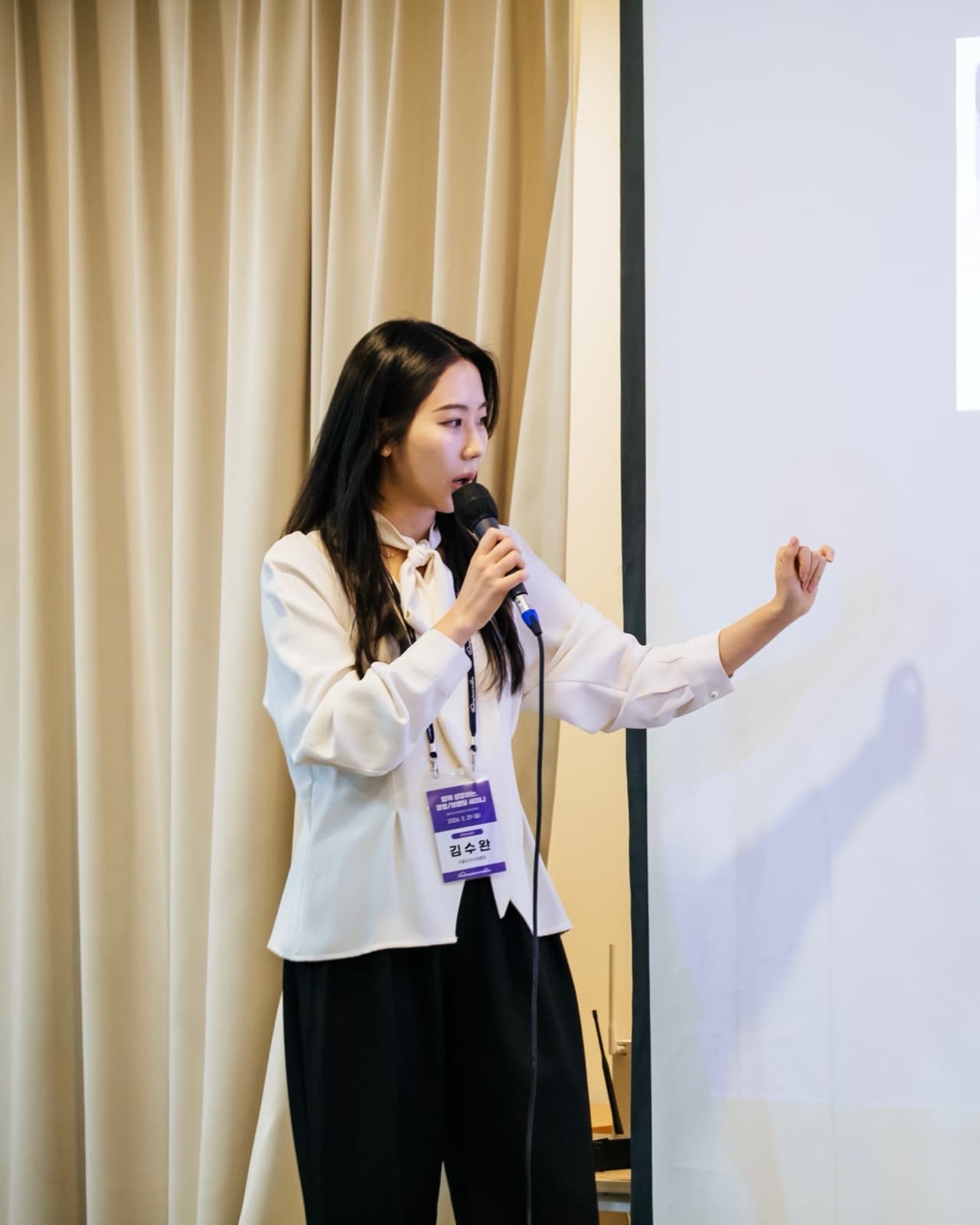 Dr. Kim Suwan speaking at a dental seminar
