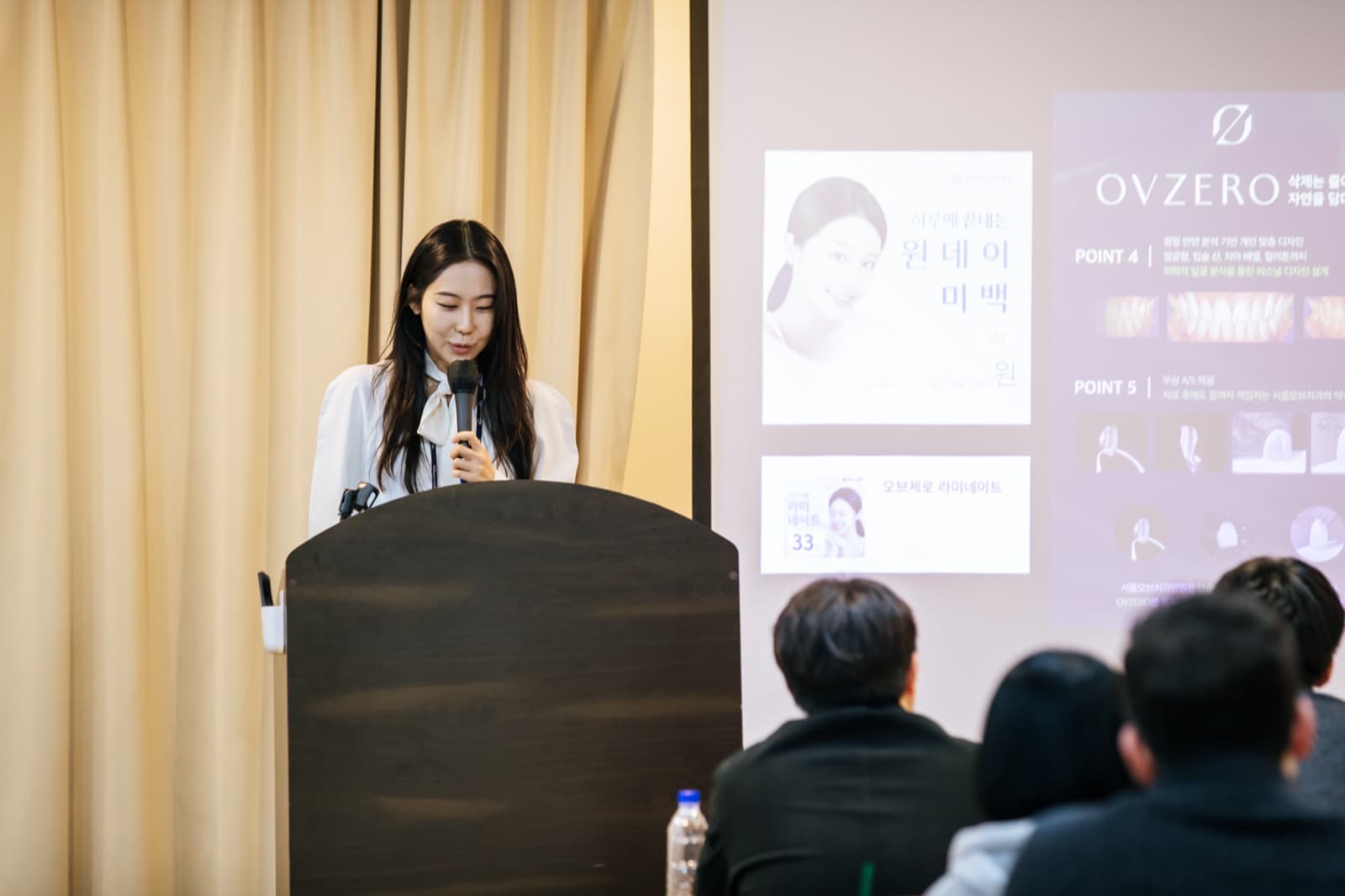 Dr. Kim Suwan lecturing on one-day teeth whitening